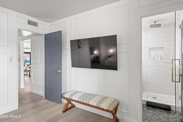 8214 E Northland Dr, Scottsdale, AZ 85251 - hallway with a decorative wall and light wood finished floors