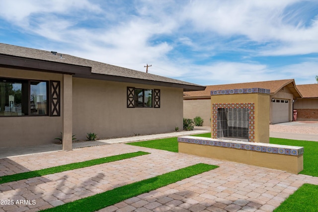 8214 E Northland Dr, Scottsdale, AZ 85251 - view of front of property featuring stucco siding and a garage