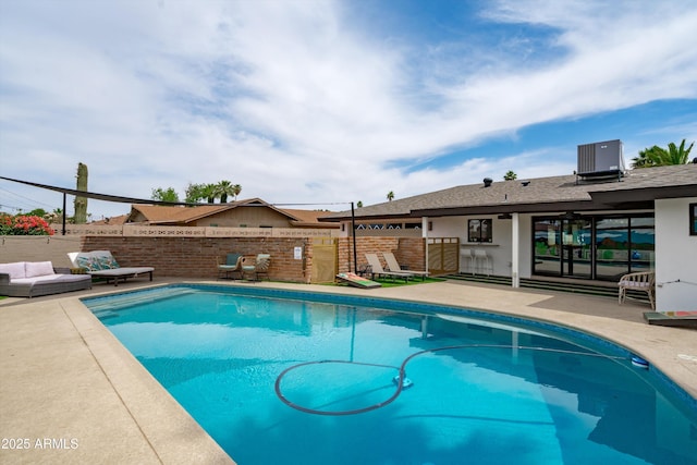 8214 E Northland Dr, Scottsdale, AZ 85251 - view of swimming pool with a patio, cooling unit, and an outdoor living space