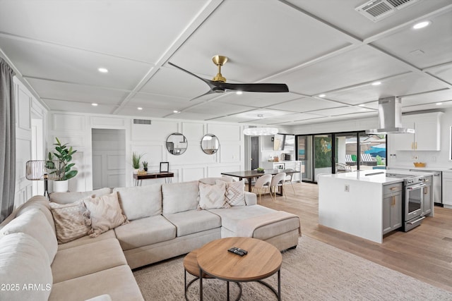 8214 E Northland Dr, Scottsdale, AZ 85251 - living room featuring ceiling fan, coffered ceiling, recessed lighting, and light wood-type flooring