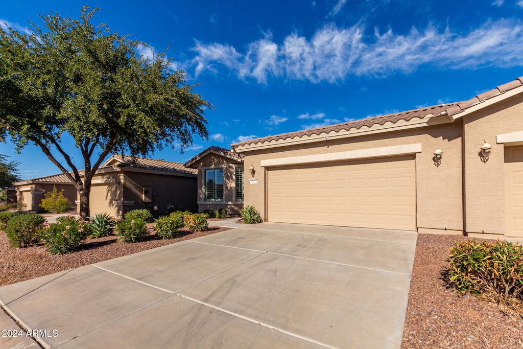 mediterranean / spanish-style house featuring a garage