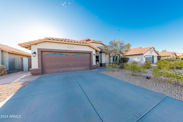 mediterranean / spanish-style home featuring a garage