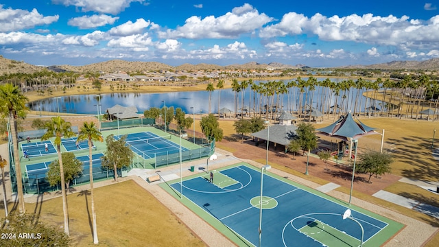 drone / aerial view with a water and mountain view