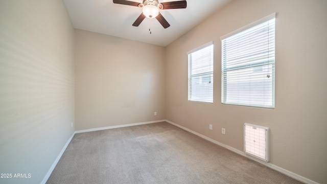empty room with visible vents, ceiling fan, baseboards, and carpet floors