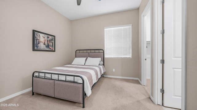 bedroom with ceiling fan, carpet, and baseboards