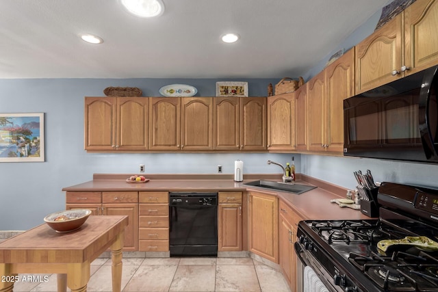 kitchen with sink and black appliances