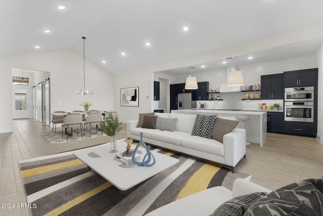 living area with high vaulted ceiling, recessed lighting, and wood tiled floor