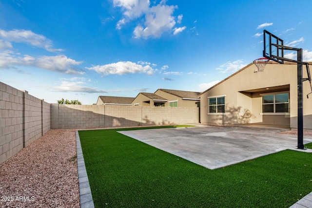 2792 E James Ave, San Tan Valley, AZ 85143 - view of yard featuring a fenced backyard, a patio, and basketball court