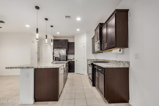 2792 E James Ave, San Tan Valley, AZ 85143 - kitchen with dark brown cabinetry, light stone countertops, appliances with stainless steel finishes, visible vents, and recessed lighting