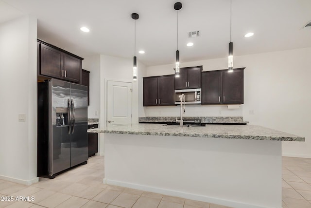 2792 E James Ave, San Tan Valley, AZ 85143 - kitchen with dark brown cabinetry, light stone countertops, appliances with stainless steel finishes, hanging light fixtures, and visible vents