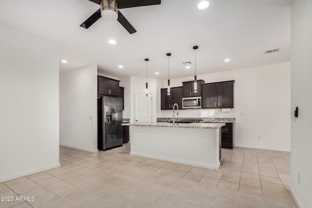 2792 E James Ave, San Tan Valley, AZ 85143 - kitchen featuring stainless steel microwave, visible vents, ceiling fan, fridge with ice dispenser, and dark brown cabinets