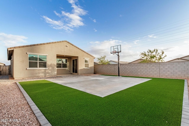 2792 E James Ave, San Tan Valley, AZ 85143 - rear view of property featuring a fenced backyard, a lawn, stucco siding, and a patio area