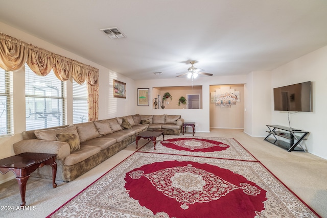 living room with ceiling fan and light carpet