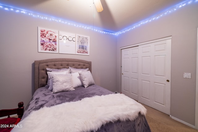 bedroom featuring a closet, ceiling fan, and carpet