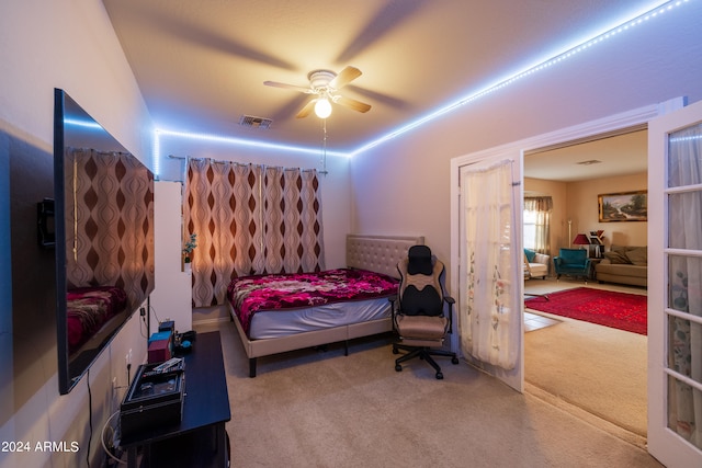 carpeted bedroom with ceiling fan