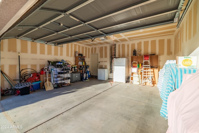 garage featuring white fridge