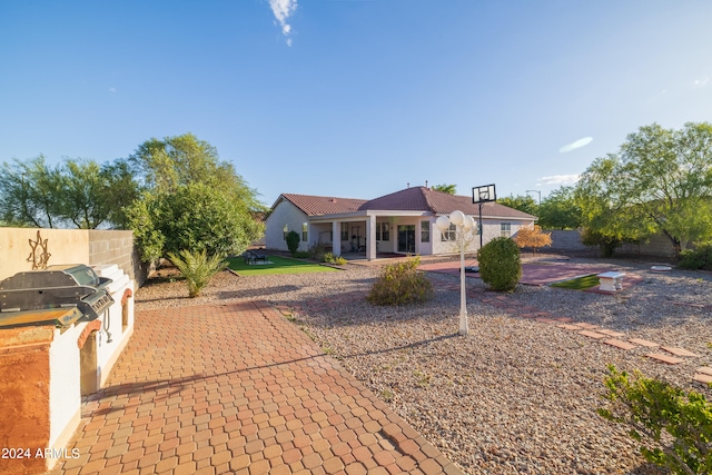 single story home with exterior kitchen