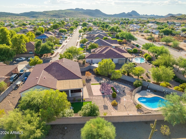 birds eye view of property featuring a mountain view