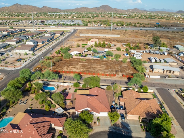 birds eye view of property featuring a mountain view