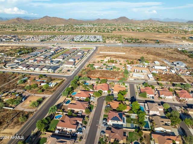 birds eye view of property with a mountain view