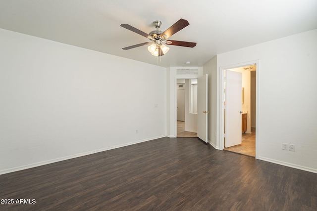 unfurnished bedroom with visible vents, baseboards, connected bathroom, ceiling fan, and dark wood-type flooring