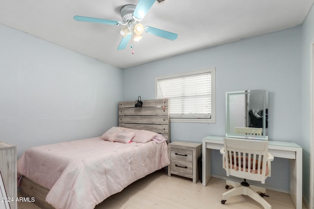 bedroom featuring light hardwood / wood-style flooring and ceiling fan