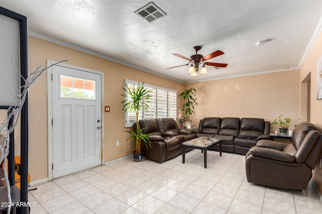 living room with ornamental molding, a wealth of natural light, a textured ceiling, and ceiling fan