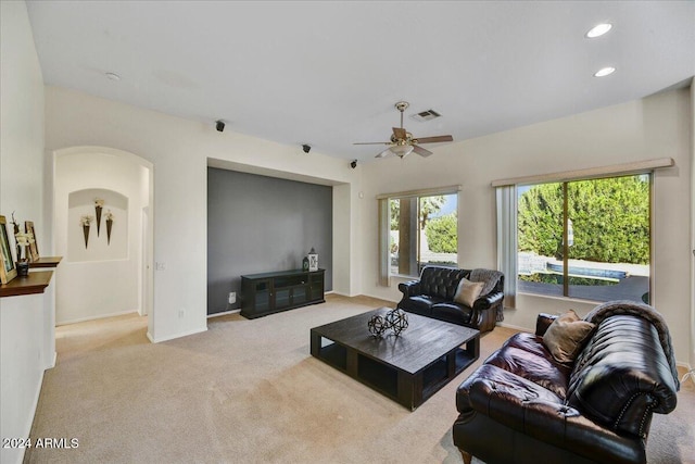 living room featuring light carpet and ceiling fan