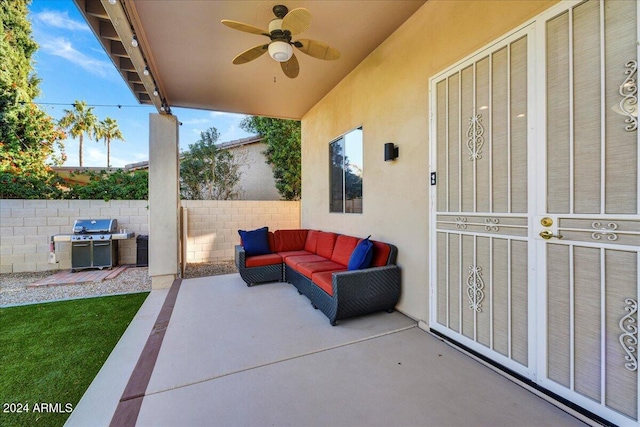 view of patio with area for grilling and ceiling fan