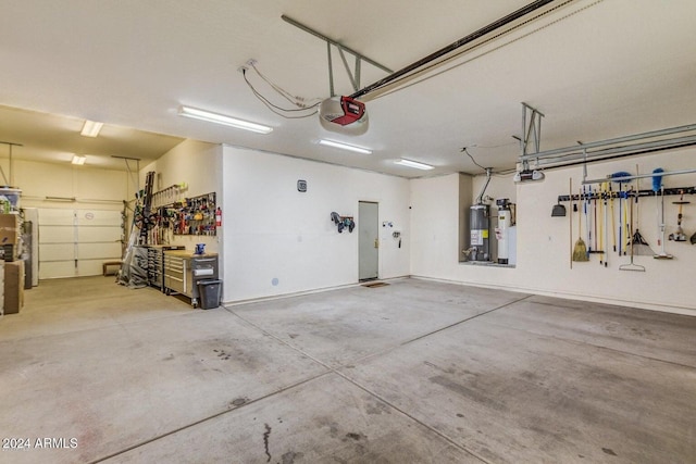 garage featuring a workshop area, gas water heater, and a garage door opener