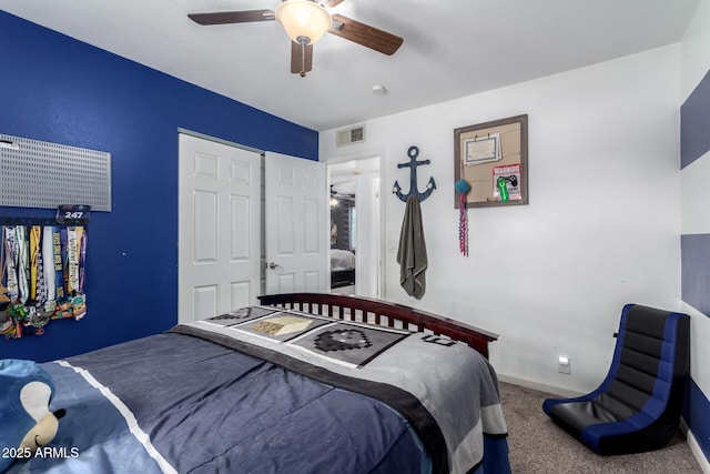 carpeted bedroom with visible vents, ceiling fan, and baseboards