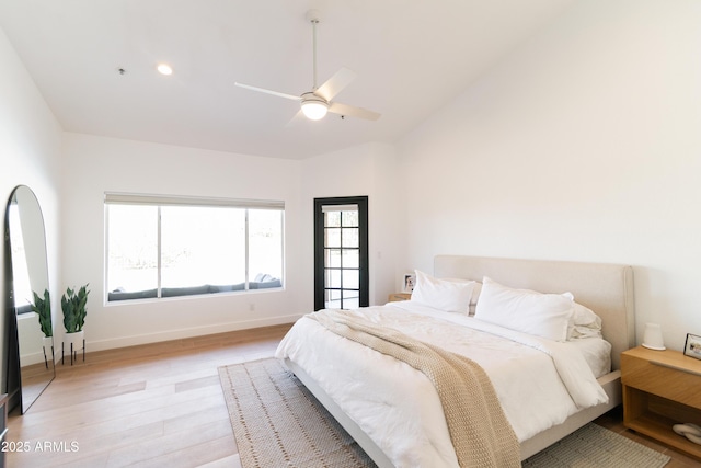 bedroom with baseboards, a ceiling fan, light wood-style flooring, vaulted ceiling, and recessed lighting