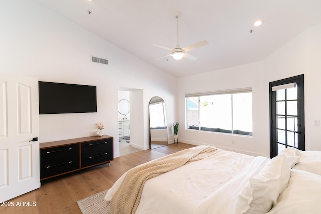 bedroom featuring light wood finished floors, recessed lighting, visible vents, ensuite bath, and baseboards