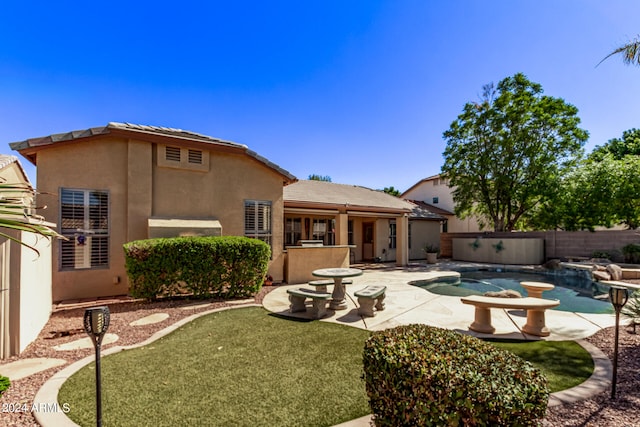 rear view of house with a patio area