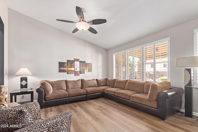 living room with hardwood / wood-style flooring and ceiling fan