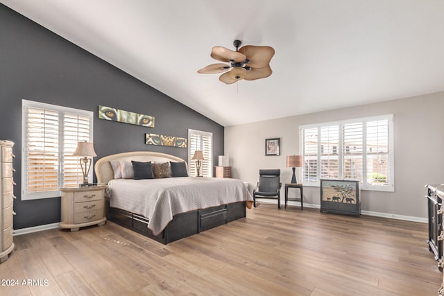 bedroom with wood-type flooring, vaulted ceiling, and ceiling fan