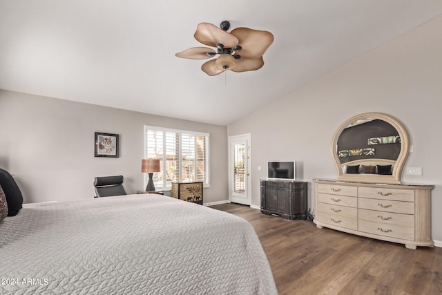 bedroom with ceiling fan, dark hardwood / wood-style flooring, access to outside, and vaulted ceiling