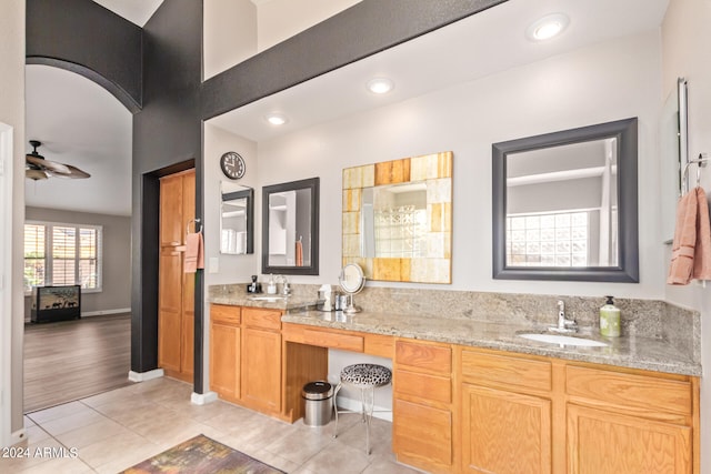 bathroom featuring tile patterned floors, ceiling fan, and vanity