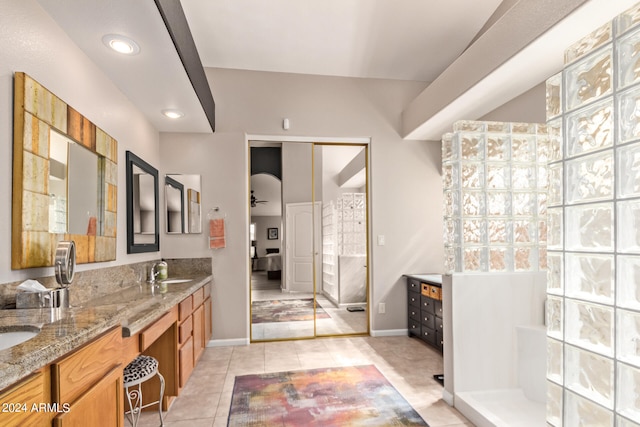 bathroom featuring a shower, vanity, tile patterned floors, and ceiling fan