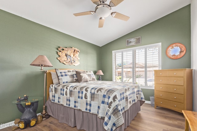 bedroom with hardwood / wood-style floors, ceiling fan, and lofted ceiling