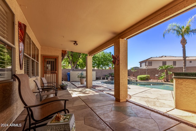 view of patio featuring a fenced in pool