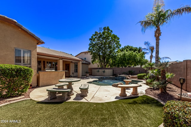 view of pool featuring a patio and a lawn