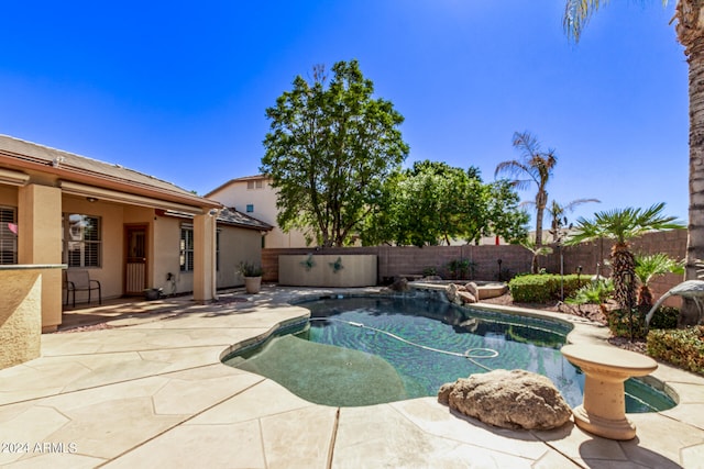 view of pool featuring a patio