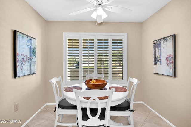 tiled dining area featuring ceiling fan