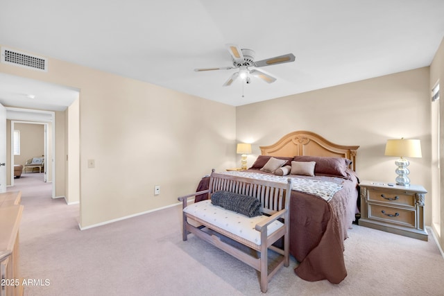 bedroom with light colored carpet and ceiling fan