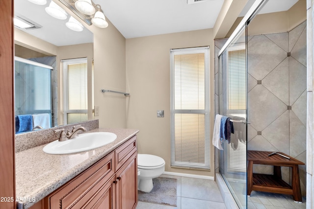 bathroom featuring tile patterned flooring, vanity, a notable chandelier, an enclosed shower, and toilet