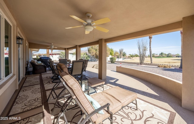 view of patio featuring ceiling fan