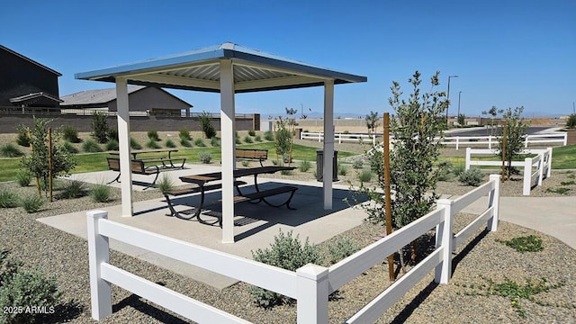 exterior space featuring a patio, central AC, fence, and a gazebo