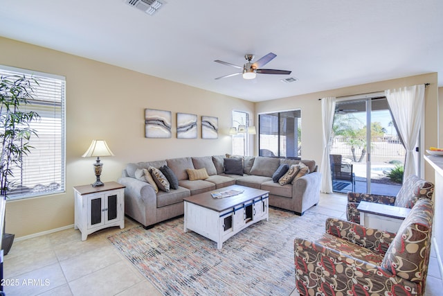 living room with light tile patterned flooring and ceiling fan