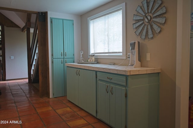 kitchen with tile patterned floors and tile countertops